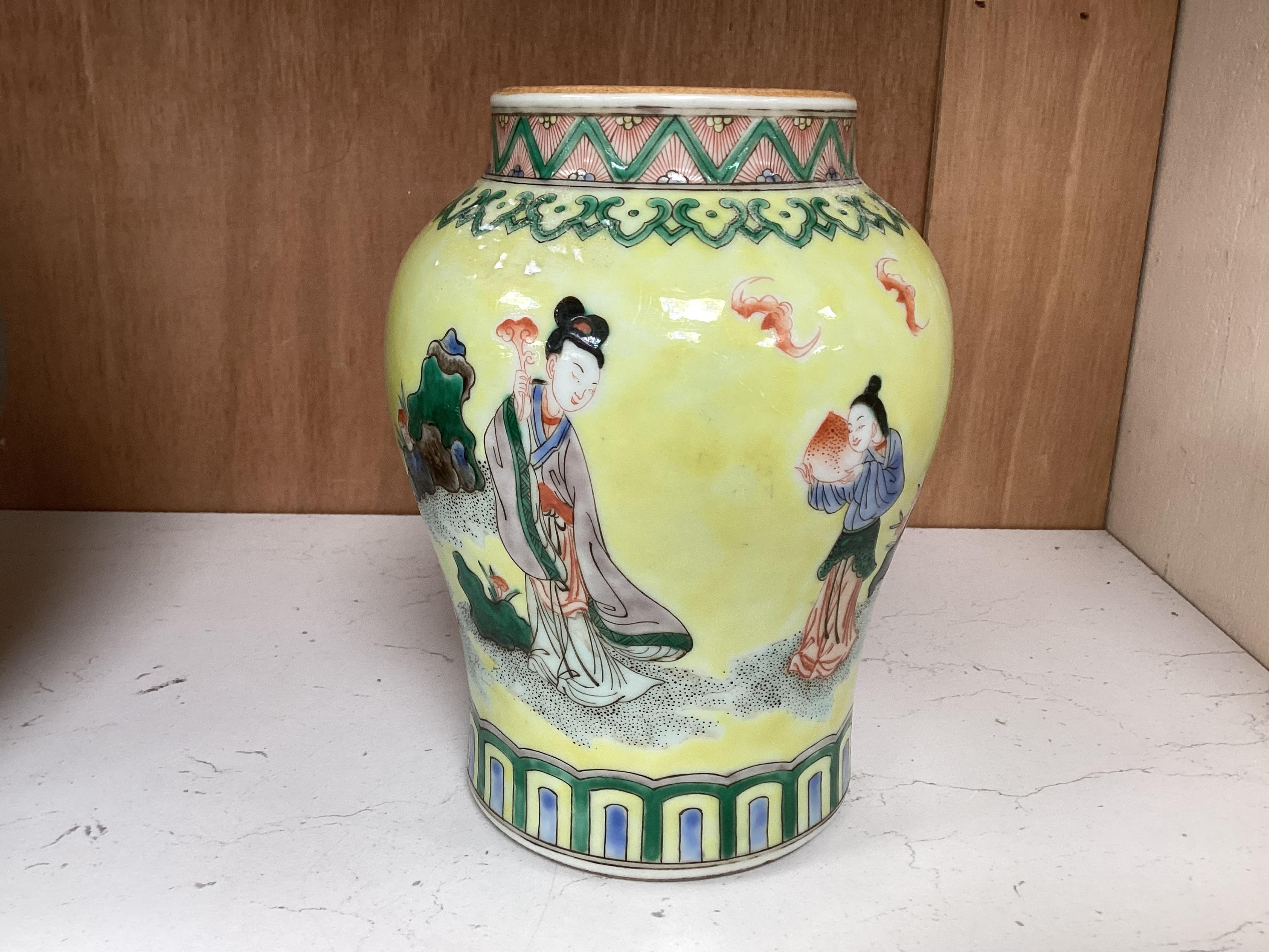 A Chinese yellow ground figurative vase, 15.5cm high. Condition - good